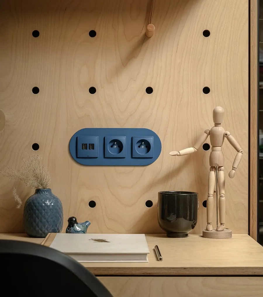 Karlik Mini navy deep blue design switch and socket on plywood wall
